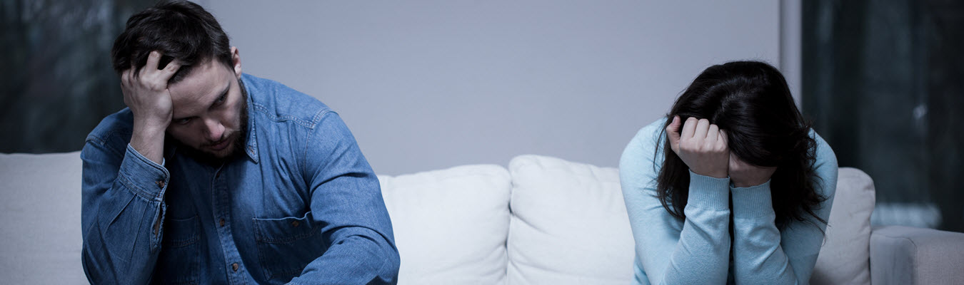 Photo of a man and woman sitting on a couch looking frustrated and upset. This photo represents how Compulsive Sexual Behavior can affect relationships. Learn how affair recovery in Georgia can help you begin to repair your relationship. Click here to learn more!