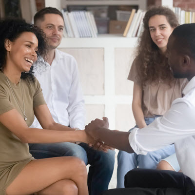 Photo of two couples talking with each other. Are you dealing with infidelity in your relationship? Meet with a couples therapist and discover how affair recovery in Georgia can help provide you with support.
