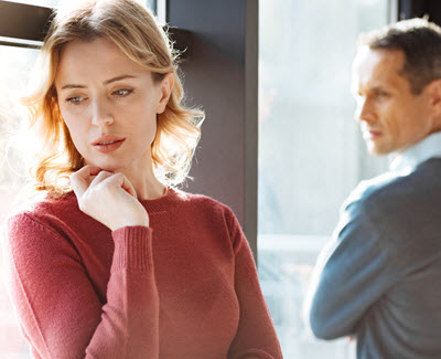 Photo of a couple where the woman looks upset as the man looks on. This photo represents the disconnection infidelity has on a relationship. Learn how affair recovery in Georgia can help you rediscover your connection.