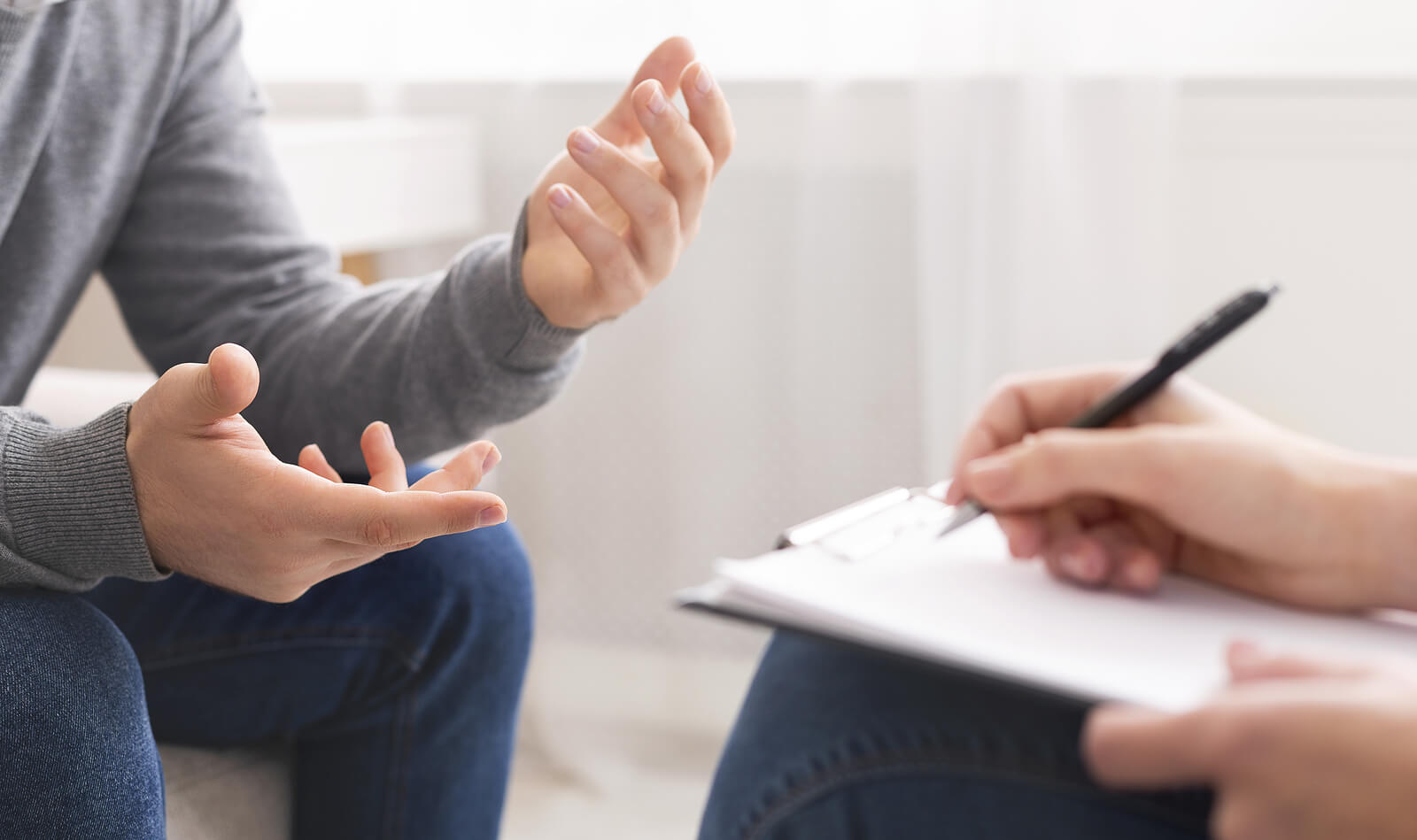 Photo of a man speaking with a skilled sexual addiction therapist to find support for sexual addiction. Learn how sexual addiction therapy in Georgia can help you begin recovery.