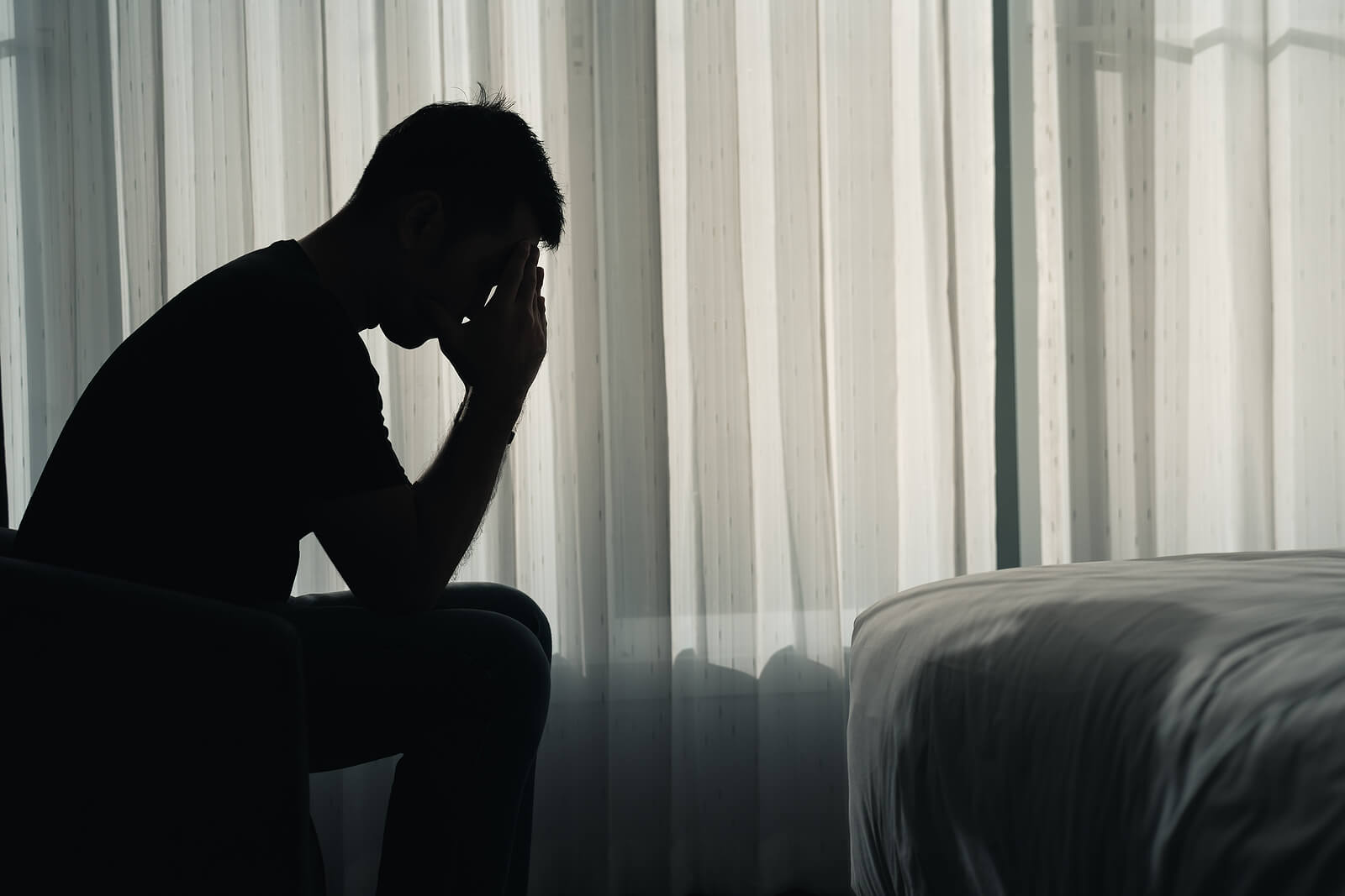 Photo of a man's silhouette looking upset with his hands on his face. Are you suffering from sexual addiction? With sexual addiction therapy in Georgia you can meet with a skilled therapist to find support.