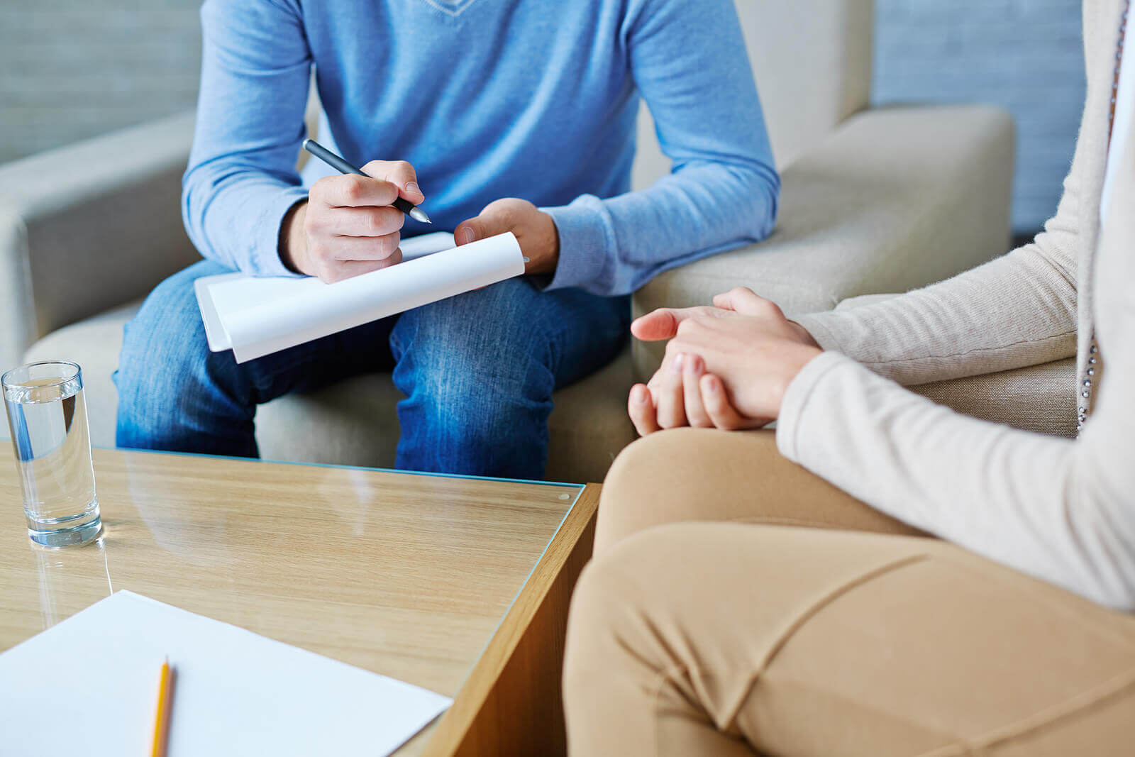 Photo of a woman speaking with a therapist working on overcoming her trauma due to betrayal. Learn how betrayal trauma in Georgia can help you face your relationship challenges.