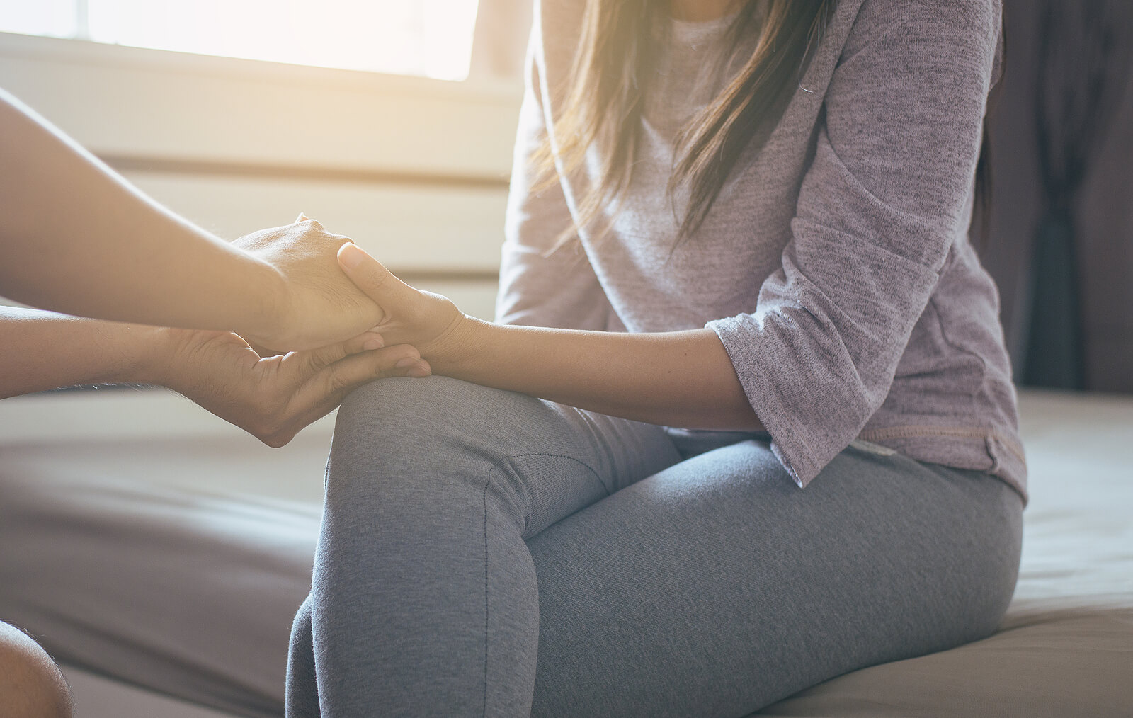 Photo of a woman holding someone's hand. Looking to recover from your anorexia? Learn how anorexia nervosa treatment in Georgia can help you on your journey to recovery.