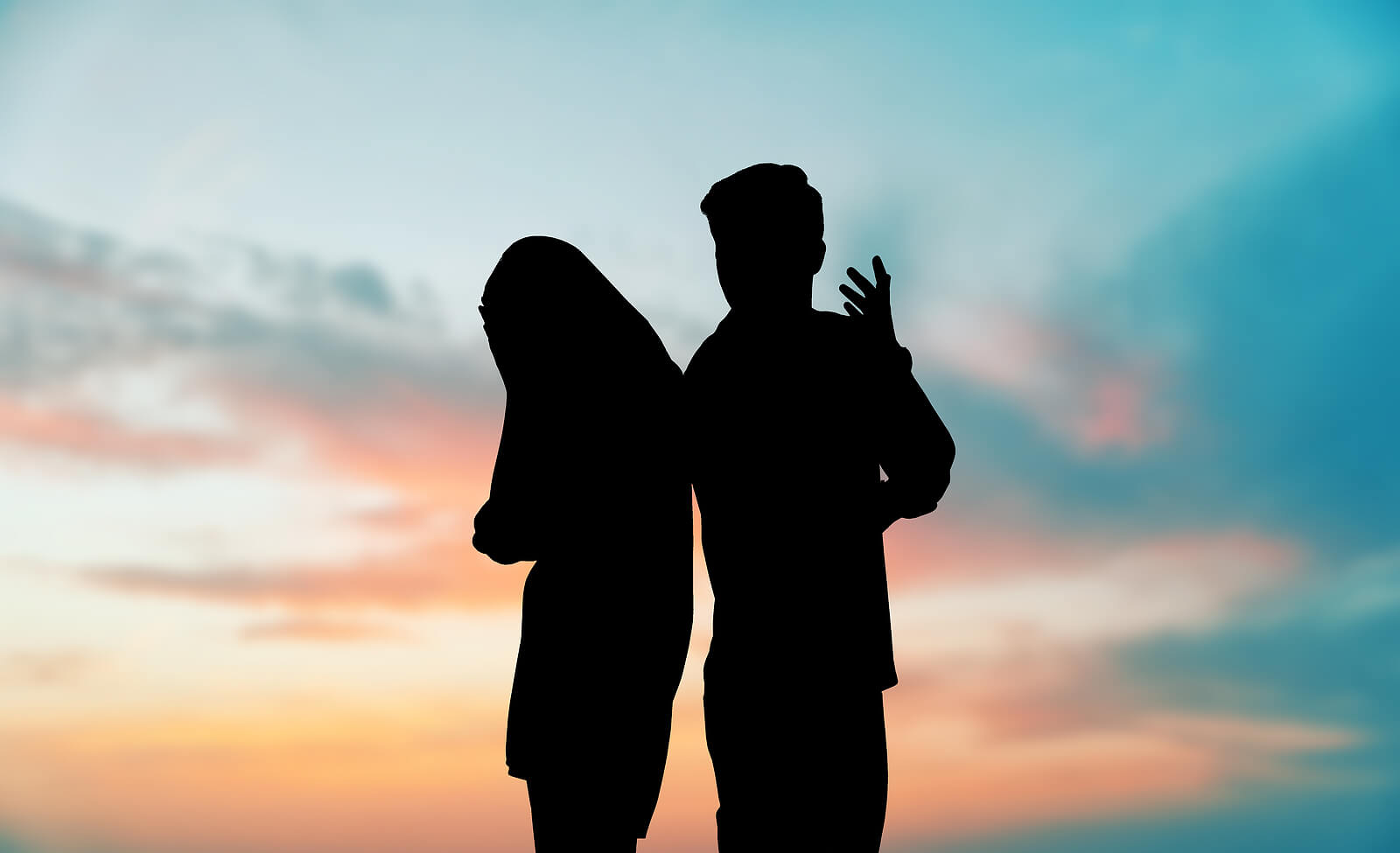 Photo of a couple arguing outside during sunset. Are you suffering from betrayal in your relationship? Learn how therapy for betrayal trauma in Georgia can help you overcome your trauma symptoms.